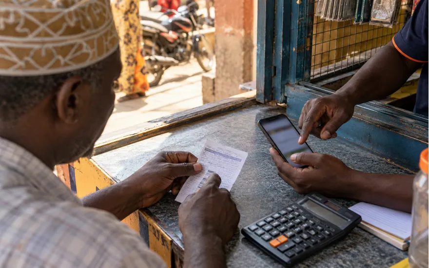 A calculator and betting phone illustrate inspecting reward eligibility